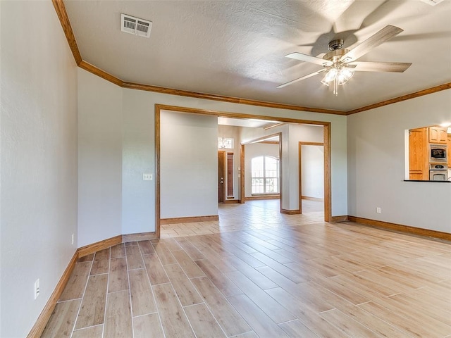 4813 SE 28th St, Oklahoma City, OK 73165 - unfurnished room featuring crown molding, a ceiling fan, and light wood-type flooring