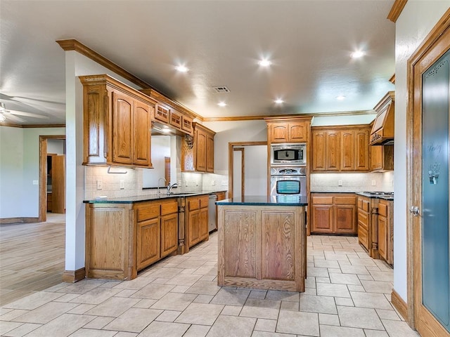 4813 SE 28th St, Oklahoma City, OK 73165 - kitchen featuring stainless steel appliances, ornamental molding, decorative backsplash, a kitchen island, and brown cabinets