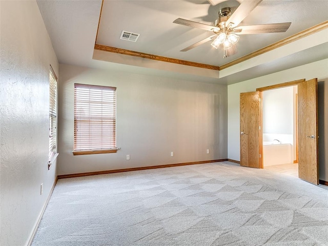 4813 SE 28th St, Oklahoma City, OK 73165 - empty room with light carpet, a ceiling fan, ornamental molding, and a raised ceiling
