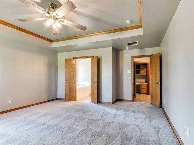 4813 SE 28th St, Oklahoma City, OK 73165 - unfurnished bedroom with crown molding, light colored carpet, a raised ceiling, and a walk in closet