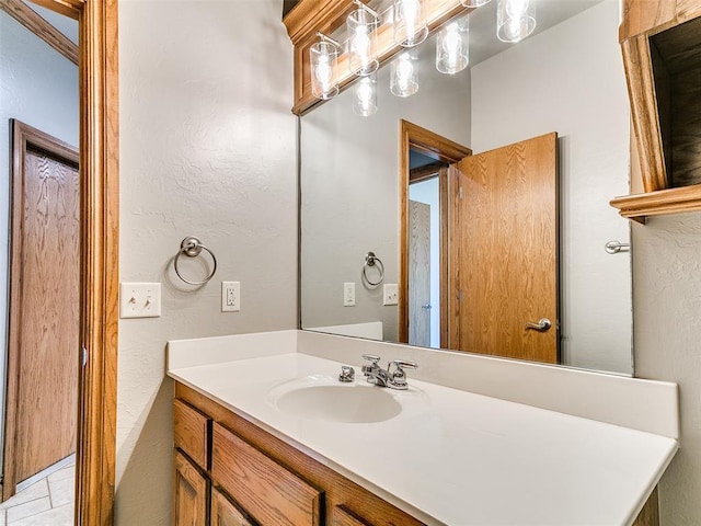 4813 SE 28th St, Oklahoma City, OK 73165 - bathroom featuring vanity and a textured wall