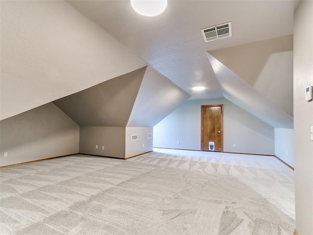 4813 SE 28th St, Oklahoma City, OK 73165 - additional living space featuring light carpet and lofted ceiling
