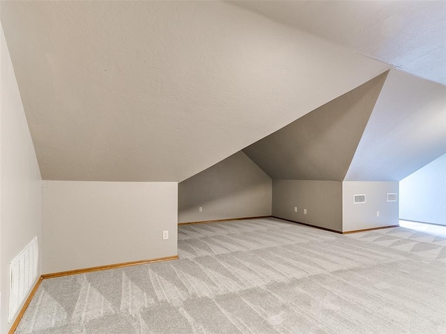 4813 SE 28th St, Oklahoma City, OK 73165 - additional living space featuring carpet flooring and vaulted ceiling