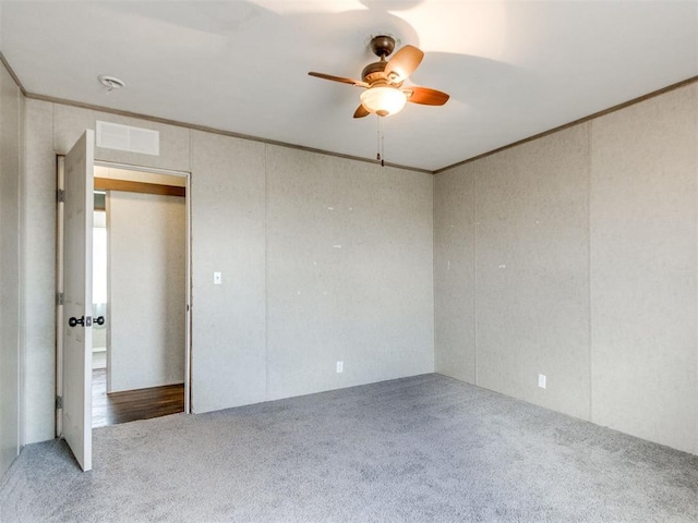 27795 N 2880th Rd, Kingfisher, OK 73750 - empty room featuring carpet flooring, a ceiling fan, and crown molding