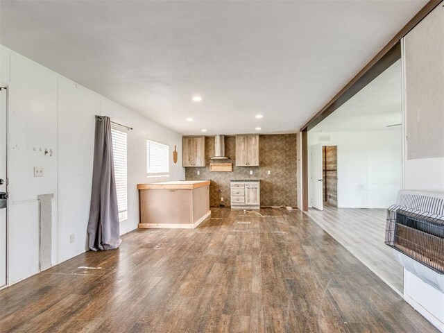27795 N 2880th Rd, Kingfisher, OK 73750 - kitchen featuring wall chimney exhaust hood, heating unit, dark wood-type flooring, recessed lighting, and open floor plan