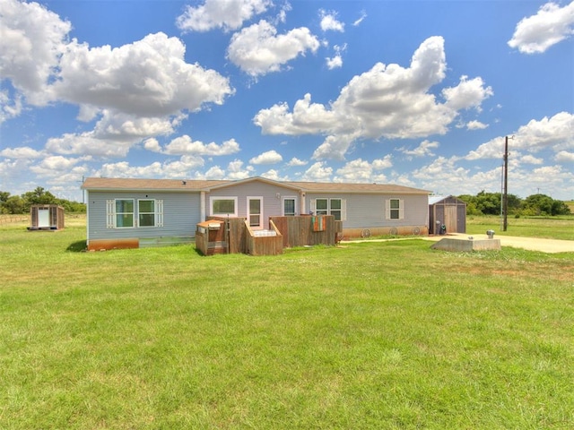 27795 N 2880th Rd, Kingfisher, OK 73750 - rear view of house with a storage unit and a lawn