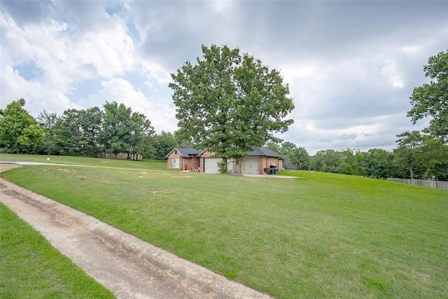 7712 Timber Creek Dr, Choctaw, OK 73020 - view of green lawn featuring a garage