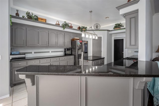 7712 Timber Creek Dr, Choctaw, OK 73020 - kitchen with gray cabinets, stainless steel fridge with ice dispenser, and a peninsula