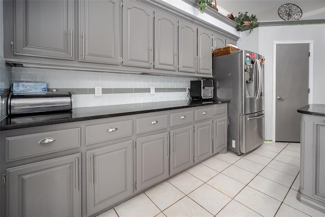 7712 Timber Creek Dr, Choctaw, OK 73020 - kitchen with gray cabinetry, stainless steel refrigerator with ice dispenser, and backsplash