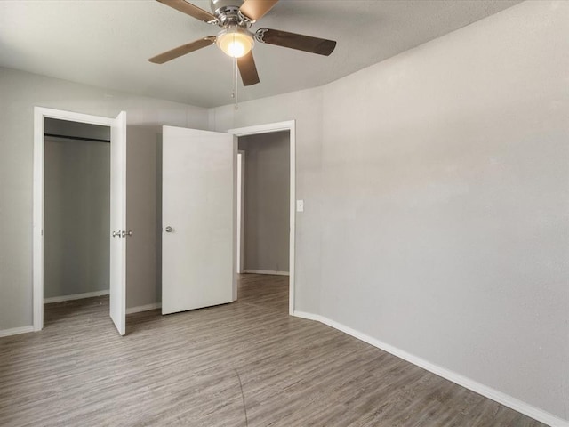 3927 SE 10th Pl, Del City, OK 73115 - unfurnished bedroom featuring wood finished floors and a ceiling fan