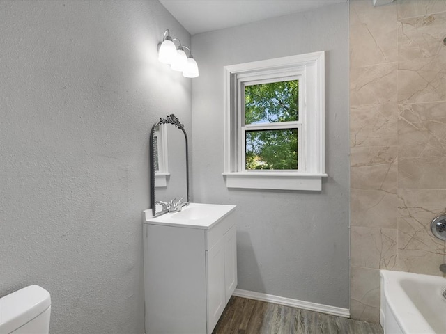 3927 SE 10th Pl, Del City, OK 73115 - bathroom with wood finished floors, vanity, and  shower combination