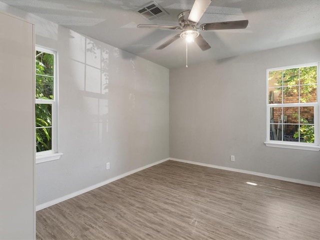 3927 SE 10th Pl, Del City, OK 73115 - spare room with wood finished floors and a ceiling fan