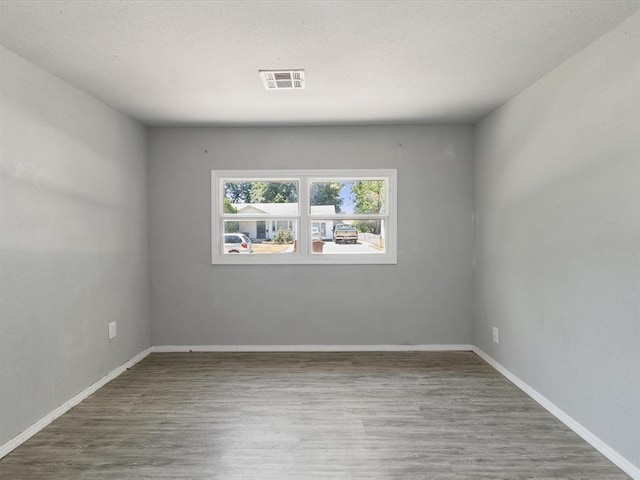 3927 SE 10th Pl, Del City, OK 73115 - unfurnished room featuring wood finished floors