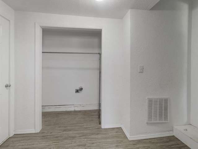 3927 SE 10th Pl, Del City, OK 73115 - laundry room featuring wood finished floors and baseboards