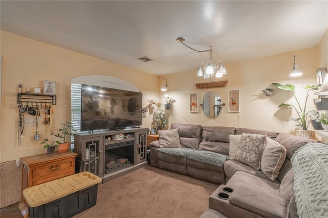 957 N Windermere Dr, Moore, OK 73160 - living room featuring carpet floors and a chandelier
