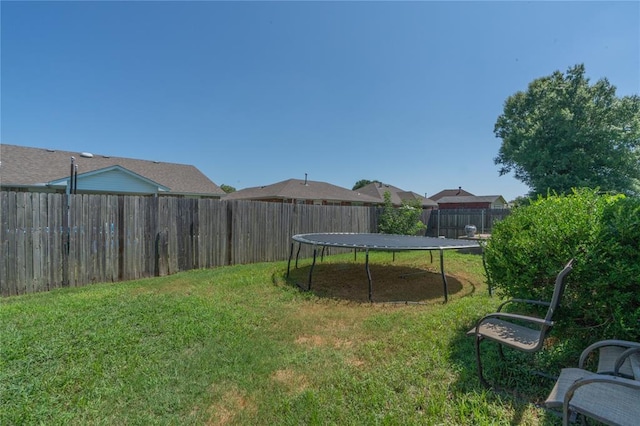 957 N Windermere Dr, Moore, OK 73160 - fenced backyard with a trampoline