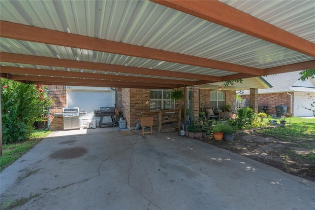 957 N Windermere Dr, Moore, OK 73160 - view of patio / terrace with a carport and a grill