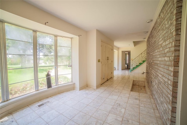 1507 Mill Creek Rd, Edmond, OK 73025 - hall with brick wall