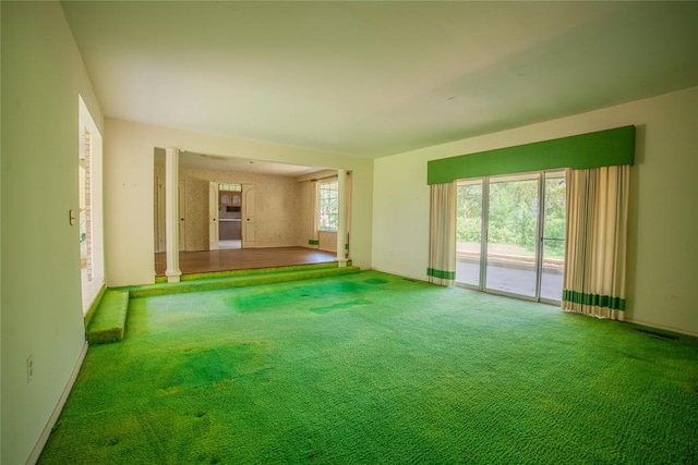 1507 Mill Creek Rd, Edmond, OK 73025 - unfurnished living room with carpet floors and baseboards
