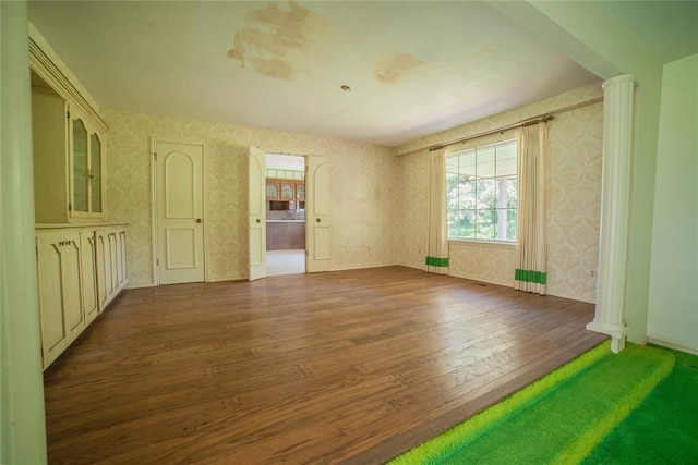 1507 Mill Creek Rd, Edmond, OK 73025 - spare room featuring wallpapered walls and hardwood / wood-style floors