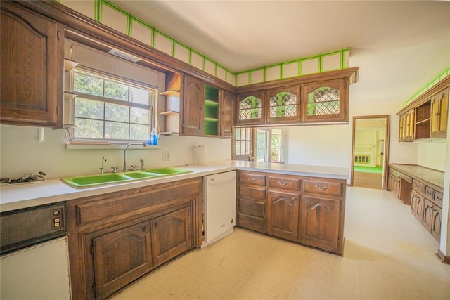 1507 Mill Creek Rd, Edmond, OK 73025 - kitchen featuring dishwasher, open shelves, healthy amount of natural light, and a peninsula