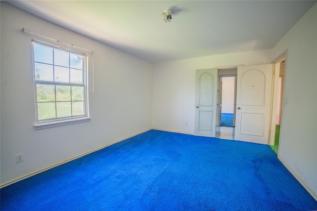 1507 Mill Creek Rd, Edmond, OK 73025 - carpeted spare room with baseboards