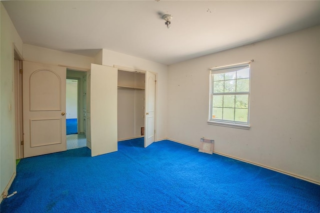 1507 Mill Creek Rd, Edmond, OK 73025 - unfurnished bedroom featuring carpet floors and a closet