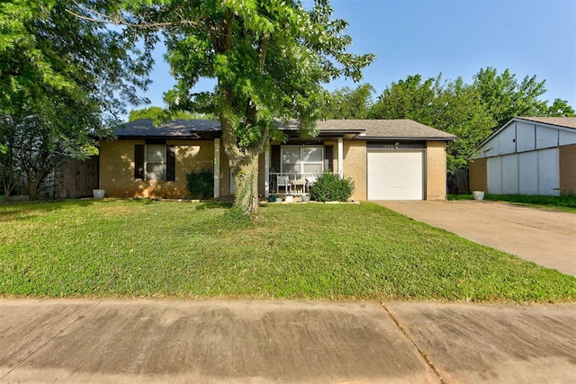 625 N Ramblin Oaks Dr, Moore, OK 73160 - ranch-style house with brick siding, driveway, a garage, and a front lawn