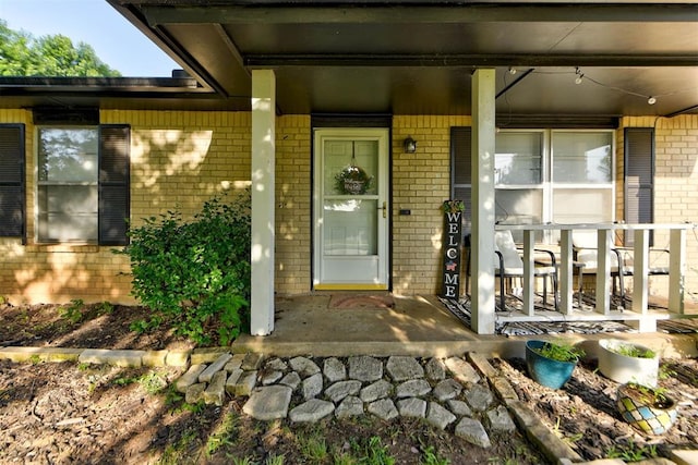 625 N Ramblin Oaks Dr, Moore, OK 73160 - doorway to property with brick siding and covered porch