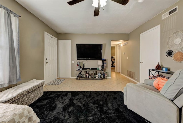 625 N Ramblin Oaks Dr, Moore, OK 73160 - living area with ceiling fan and tile patterned flooring