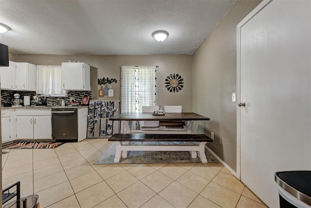 625 N Ramblin Oaks Dr, Moore, OK 73160 - kitchen with dishwasher, tasteful backsplash, white cabinets, light tile patterned floors, and light countertops
