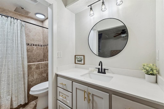 8 Corona Dr, Oklahoma City, OK 73149 - bathroom featuring vanity, tiled shower, ceiling fan, and tile patterned floors