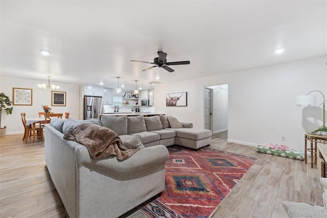 8 Corona Dr, Oklahoma City, OK 73149 - living room with a chandelier, light wood-type flooring, a ceiling fan, and recessed lighting