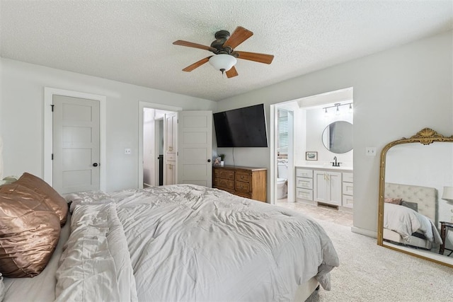 8 Corona Dr, Oklahoma City, OK 73149 - bedroom featuring ensuite bathroom, a textured ceiling, light colored carpet, and ceiling fan