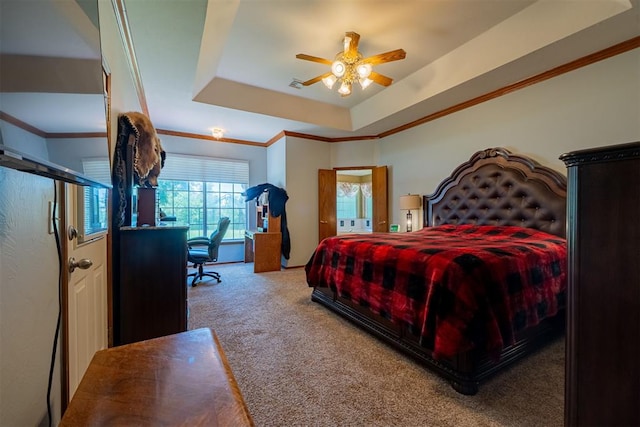 4700 SE 118th St, Oklahoma City, OK 73165 - carpeted bedroom with a raised ceiling, ornamental molding, ceiling fan, and a desk