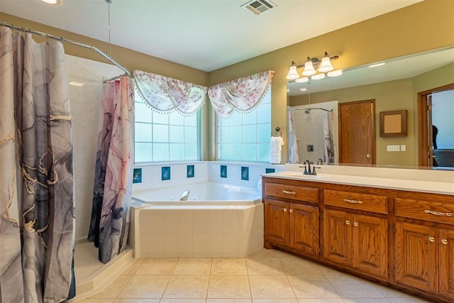 4700 SE 118th St, Oklahoma City, OK 73165 - full bathroom with a shower stall, vanity, a garden tub, and tile patterned flooring