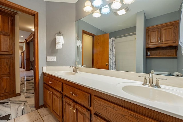 4700 SE 118th St, Oklahoma City, OK 73165 - bathroom with double vanity, marble finish flooring, and a shower with shower curtain