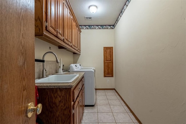 4700 SE 118th St, Oklahoma City, OK 73165 - washroom with cabinet space, independent washer and dryer, and light tile patterned floors