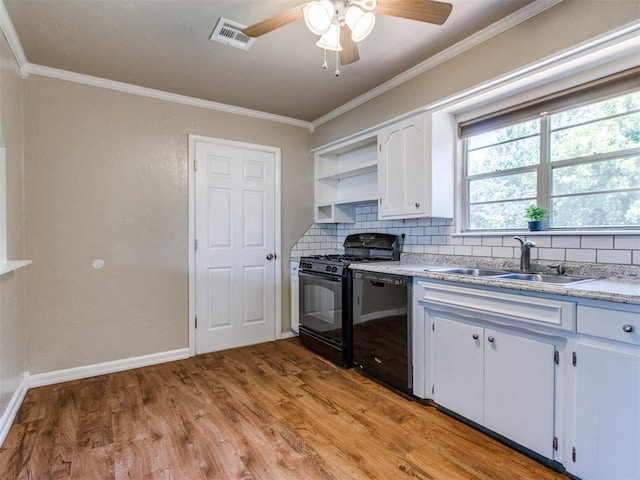 117 Asbill Ave, Yukon, OK 73099 - kitchen featuring black appliances, open shelves, backsplash, ceiling fan, and light wood-style flooring