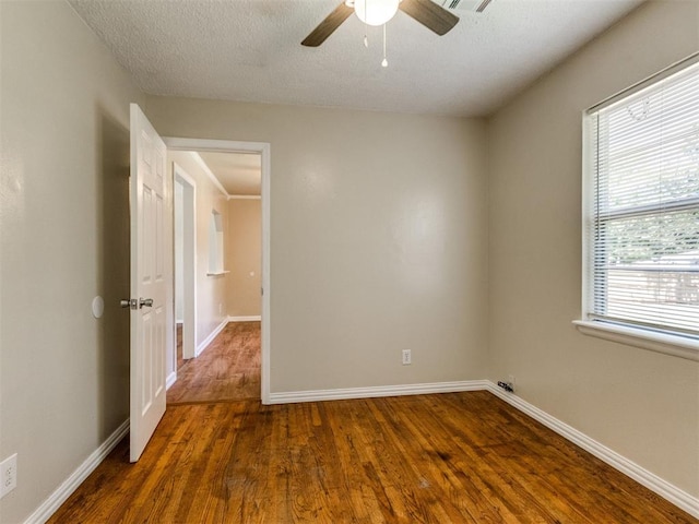 117 Asbill Ave, Yukon, OK 73099 - unfurnished room featuring wood finished floors, ceiling fan, and a textured ceiling