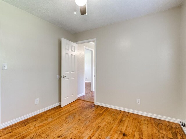 117 Asbill Ave, Yukon, OK 73099 - unfurnished room featuring a ceiling fan and light wood-style flooring
