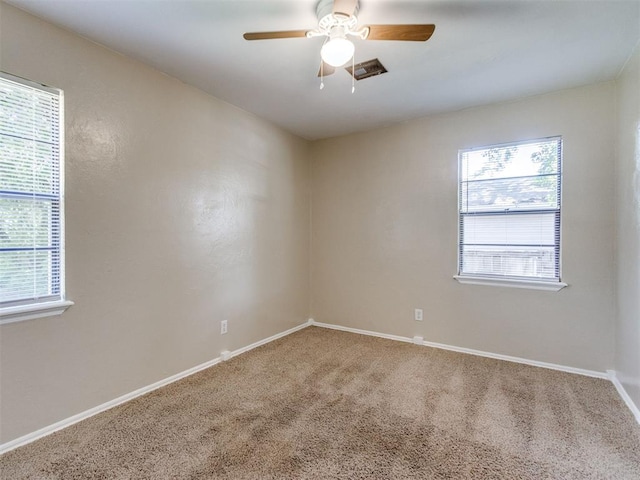 117 Asbill Ave, Yukon, OK 73099 - spare room with carpet floors, healthy amount of natural light, and a ceiling fan