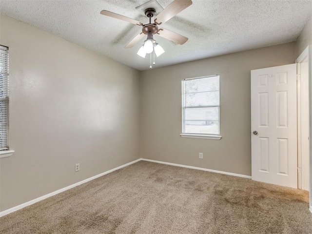 117 Asbill Ave, Yukon, OK 73099 - unfurnished room featuring carpet floors, a textured ceiling, and a ceiling fan