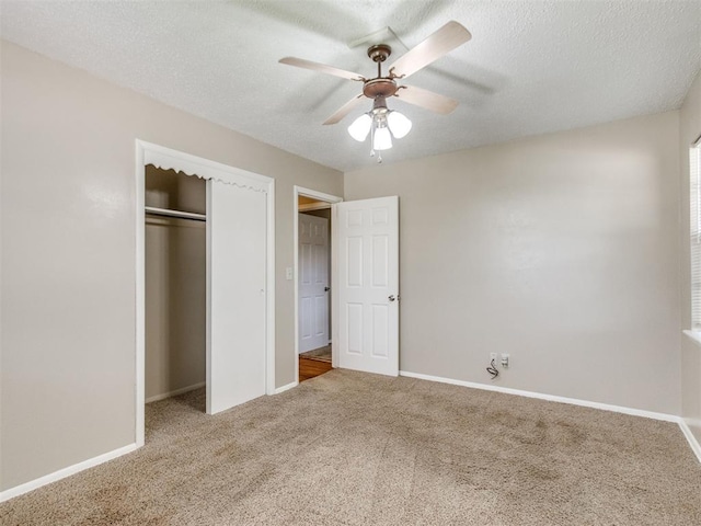 117 Asbill Ave, Yukon, OK 73099 - unfurnished bedroom with carpet floors, a closet, a textured ceiling, and a ceiling fan