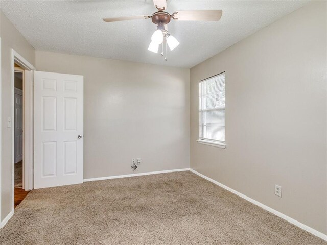 117 Asbill Ave, Yukon, OK 73099 - carpeted empty room featuring a ceiling fan and a textured ceiling