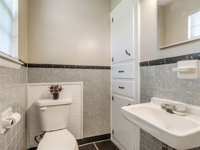117 Asbill Ave, Yukon, OK 73099 - half bathroom featuring tile walls and a wainscoted wall