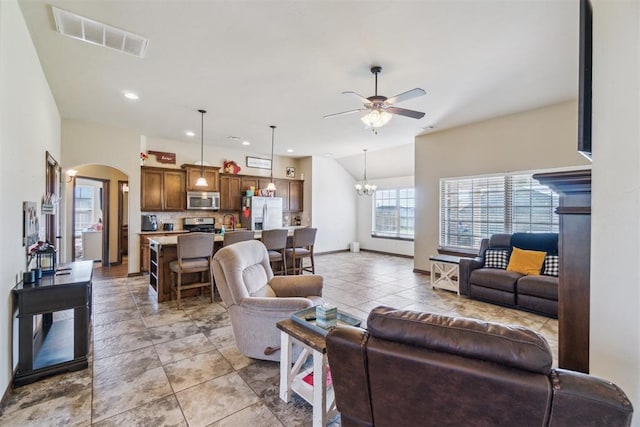 3730 Ruby Rdg, Piedmont, OK 73078 - living room featuring ceiling fan, arched walkways, light tile patterned flooring, a chandelier, and recessed lighting