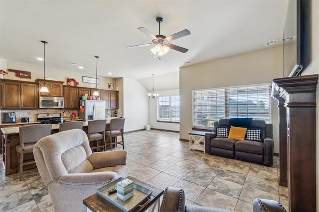 3730 Ruby Rdg, Piedmont, OK 73078 - living room with ceiling fan, vaulted ceiling, a chandelier, recessed lighting, and light tile patterned floors