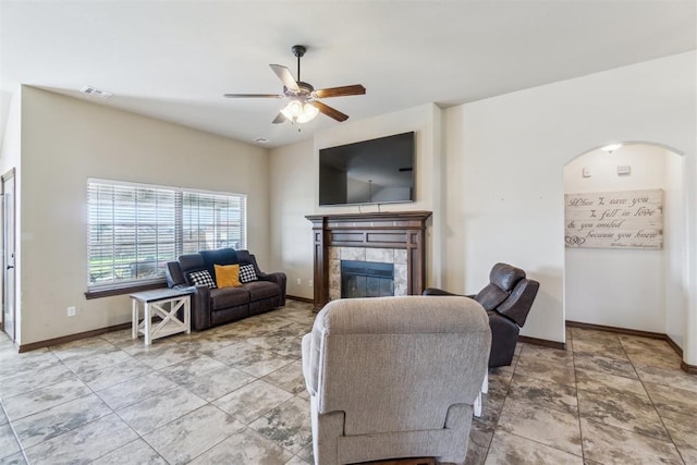 3730 Ruby Rdg, Piedmont, OK 73078 - living area with ceiling fan, a fireplace, and arched walkways