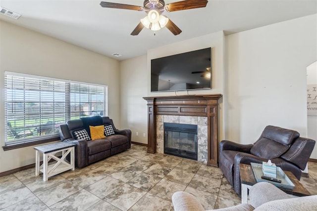 3730 Ruby Rdg, Piedmont, OK 73078 - living room featuring a tiled fireplace and ceiling fan